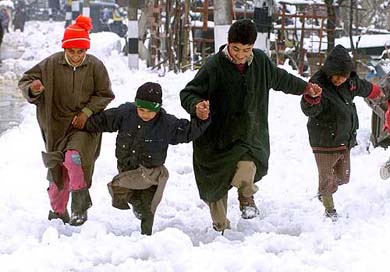 Children play on fresh snow 