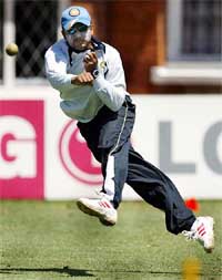 Indias Virender Sehwag throws the ball during a team practice session