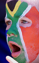 A South African fan cheers during his team's match against Bangladesh