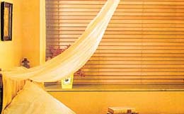 Experiment with laser chiffon canopies or tissue valances in your bedroom