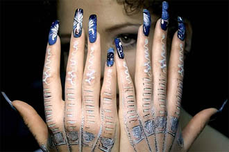 A Russian model shows her hands during a contest 