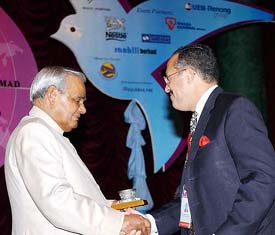 Prime minister Atal Behari Vajpayee receives a memento from Zarir Cama
