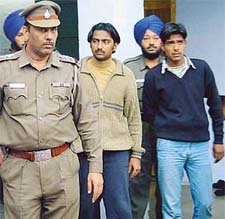 Two ISI spies, Aabid Mehmood and Mohammed Aarif, being taken for police remand