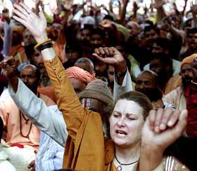 A foreigner sadhvi chants slogan with others during Dharma Sansad