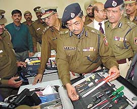 After the inauguration of the Delhi Metro Rail police station building Delhi Police Commissioner R.S.Gupta examines the investigation tool kit on Monday