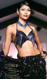 A model displays a bridal outfit 