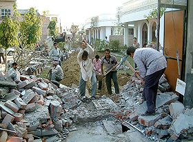 The workers of PUDA lay demarcation about PUDA land near the house of a resident in Bathinda