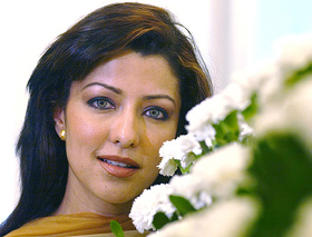 Bollywood star and former Mrs World Aditi Govitrikar poses while introducing a range of Indian skincare products