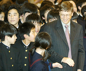 Microsoft Corp Chairman and Chief Software Architect Bill Gates chats with Japanese junior high school students