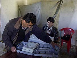 Polling officials checks electronic voting machines