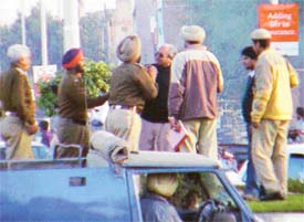 Policemen take away Mr Sudarshan Kumar, an iron merchant, who sat in dharna in protest against his alleged harassment at the hands of senior police officials