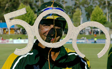 Wasim Akram holds up a 500 sign after Pakistan's match against Holland 