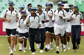 Indian players jog during a practice session in Durban