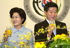 South Korean President Roh Moo-Hyun with his wife Kwon Yang-sook during the inauguration of the National Assembly in Seoul 
