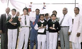 Telugu School society president B P Rao, secretary U Viswanadham and treasurer S Suryanarayan with the winners of various sports competitions at the Annual Sports Day function of the Telugu Primary and Middle School at R K Puram