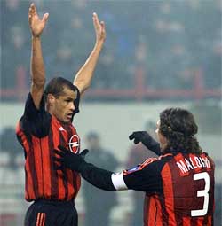 Rivaldo (L) and Paolo Maldini of AC Milan celebrate after scoring against Lokomotiv Moscow 