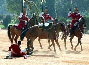 One of the Presidents bodyguards tumbles from the horse
