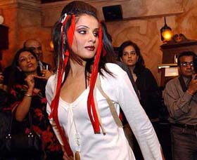 An Indian model showcases the latest product range of a cosmetic company