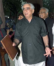 Finance Minister Jaswant Singh gestures as he arrives at Parliament 