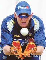 Australian wicketkeeper Adam Gilchrist catches the ball during a training session at St George Park in Port Elizabeth, South Africa