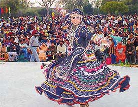 Capturing the rhythm of music, a Kalbelia dancer from Rajasthan holds the audience captive during the Festival of Gardens 