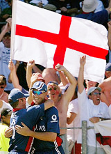 Englands Ashley Giles celebrates with Craig White after taking the catch of Australian captain Ricky Ponting 