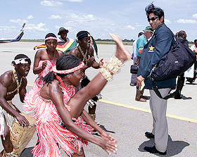 Pakistan's Wasim Akram watches traditional Zimbabwe dancers on his arrival in Bulawayo 