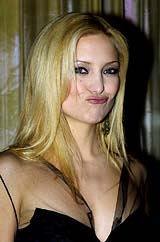 Actress Kate Hudson strikes a pose for photographers