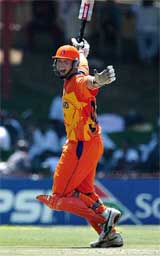 Holland's Jan Kloppenburg celebrates after scoring his team's first ever one-day century 