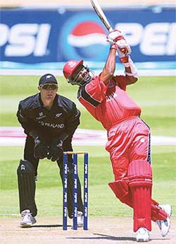 Canadian batsman, Ashish Patel smashes the ball