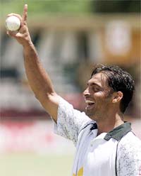 Pakistani speedstar Shoaib Akhtar laughs during a practice session 