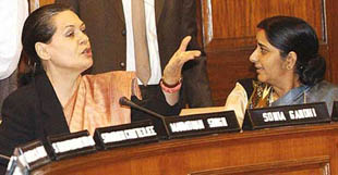 Congress President Sonia Gandhi gestures as Parliamentary Affairs Minister Sushma Swaraj