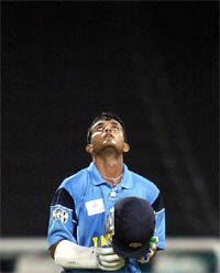 India's Saurav Ganguly looks skywards after completing his century