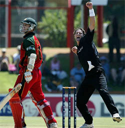 New Zealands Chris Cairns celebrates after Zimbabwes Craig Wishart