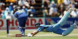 Saurav Ganguly dives to survive a run out attempt