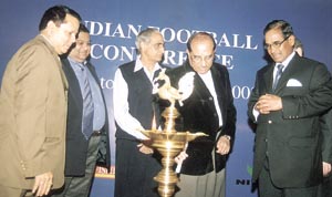 AICS president Vijay Kumar Malhotra lights a lamp