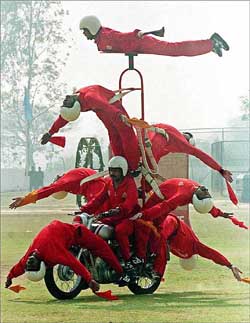 Military police of the Indian army present an acrobatic show on motorcycle