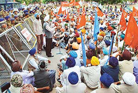A leader addresses a farmers rally held in support of their demands near the Inter-State Bus Terminus in Sector 17, Chandigarh