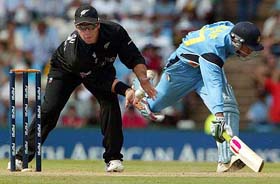 Mohammad Kaif makes his crease as New Zealand's Craig McMillan catches the ball
