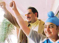 A young fan with wrestler Tiger Jeet Singh