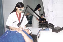 A cosmetologist attending to a customer