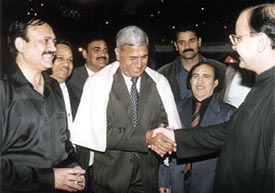 DDCA president Arun Jaitley and senior vice-president C. K. Khanna felicitating D. S. Nehra, father of Ashish Nehra