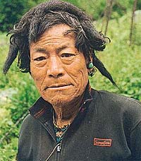 Monpaman wearing the traditional Yak hair cap
