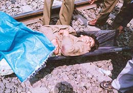 A critically injured Vandana Bhama being taken to hospital