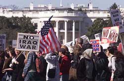 Anti-war protesters pass the White House 