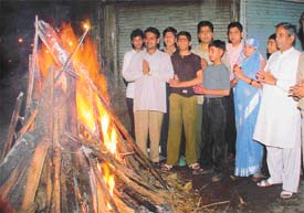 Members of Rajasthani community perform Holika Dahan at Lakkar Bazaar on Monday evening