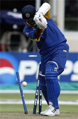Sri Lanka's Marvan Atapattu is bowled by Australia's Brett Lee 