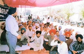 Members of the Telecom Employees Union hold a demonstration
