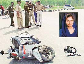 Police officials examine the spot where Simmi Marwaha was crushed to death by a school bus in Sector 42