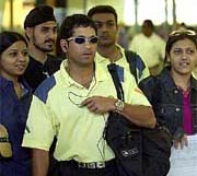 Surrounded by fans, Sachin Tendulkar and Virender Sehwag arrive at Johannesburg Airport